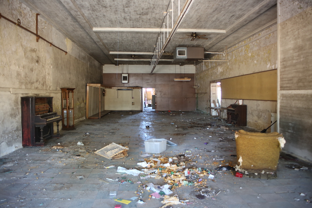 A room with lots of trash on the floor.