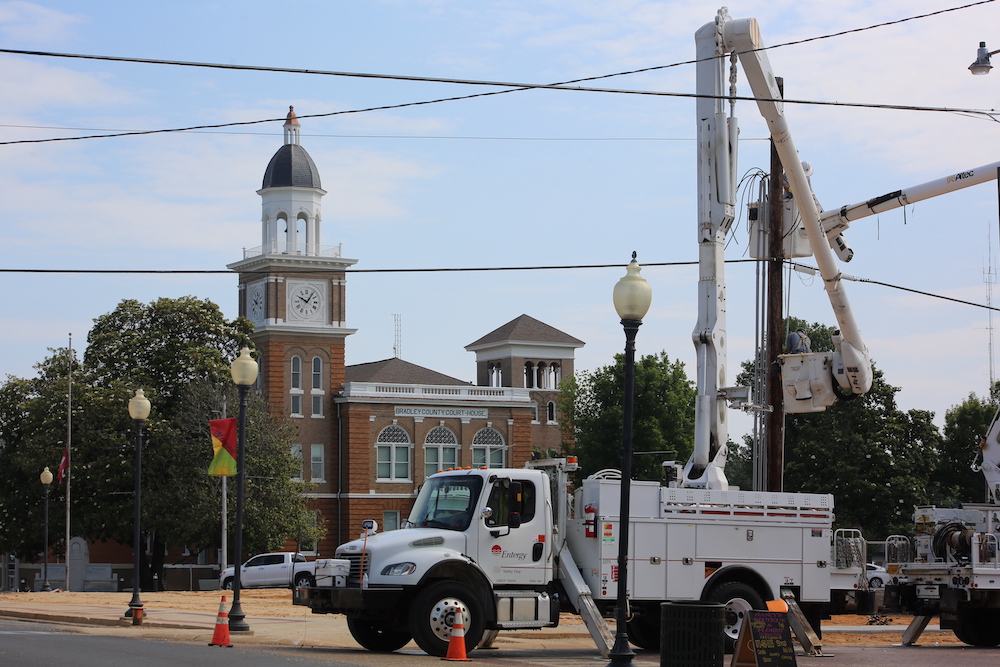 A utility truck is parked on the side of the road.