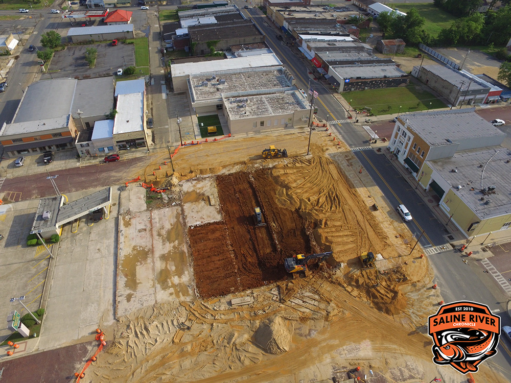 A construction site with many buildings and trees