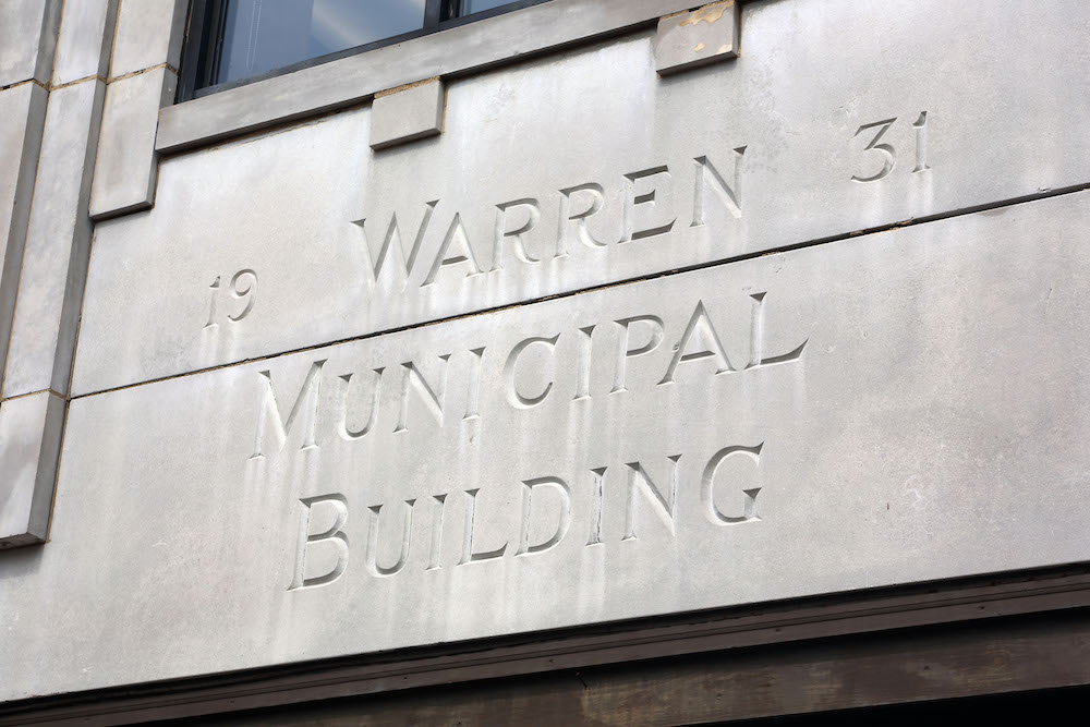 A building with the name of warren 3 and the address for the municipal building.