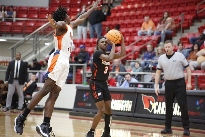 A basketball player is going to make a shot.