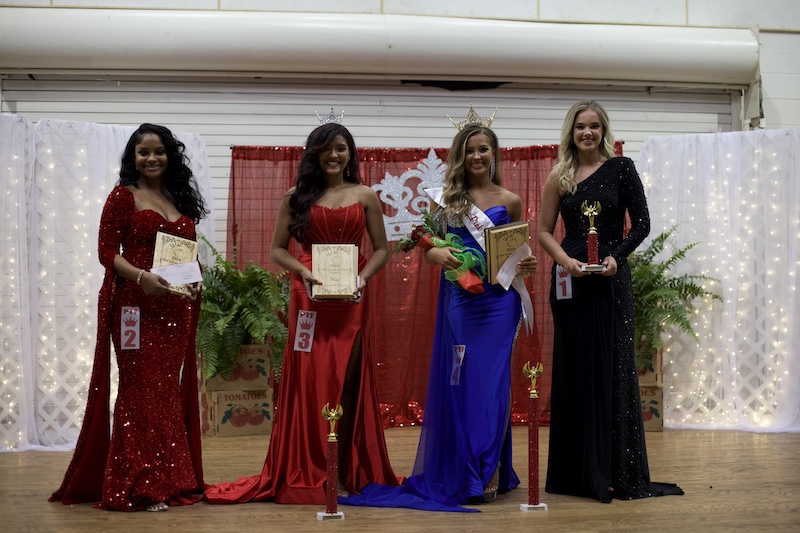 A group of women standing next to each other.