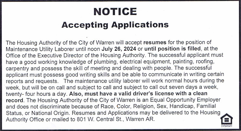A notice that is posted on the side of a building.