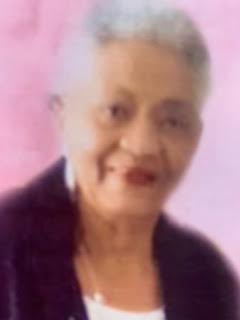 A blurry picture of an older woman with white hair.