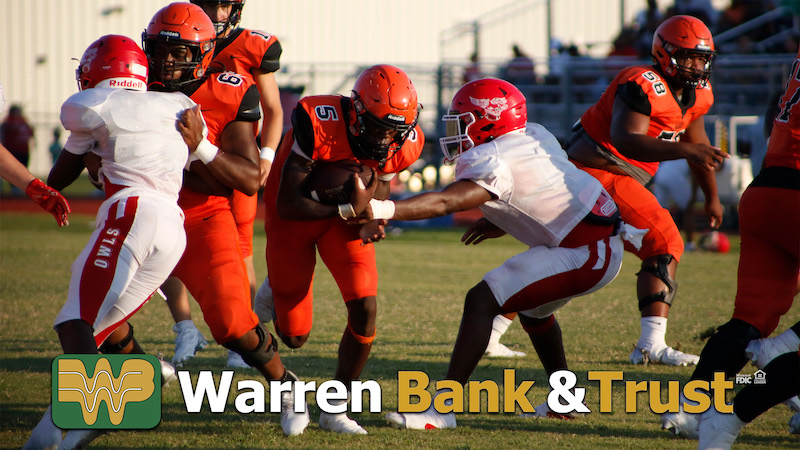 A group of football players in action on the field.