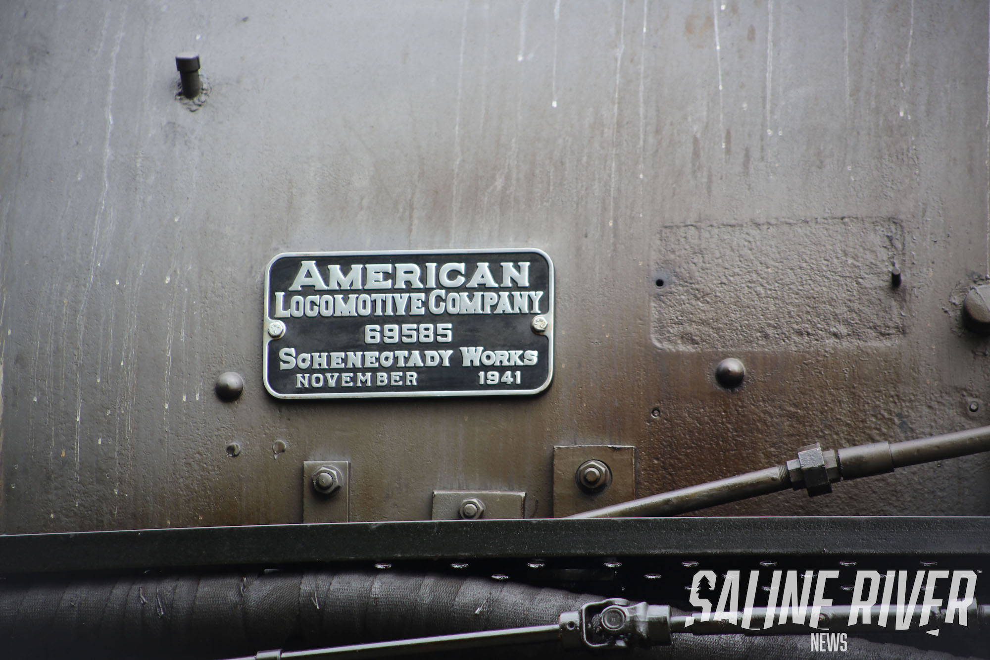 A close up of the side of an old train.
