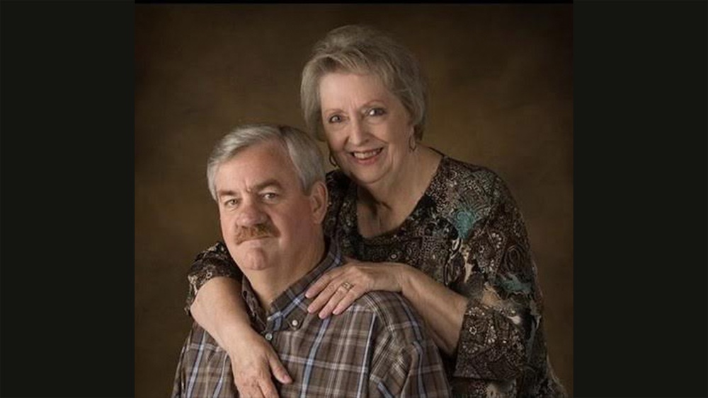 A man and woman posing for a picture.