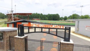 A gate that says house of the lumberjacks.