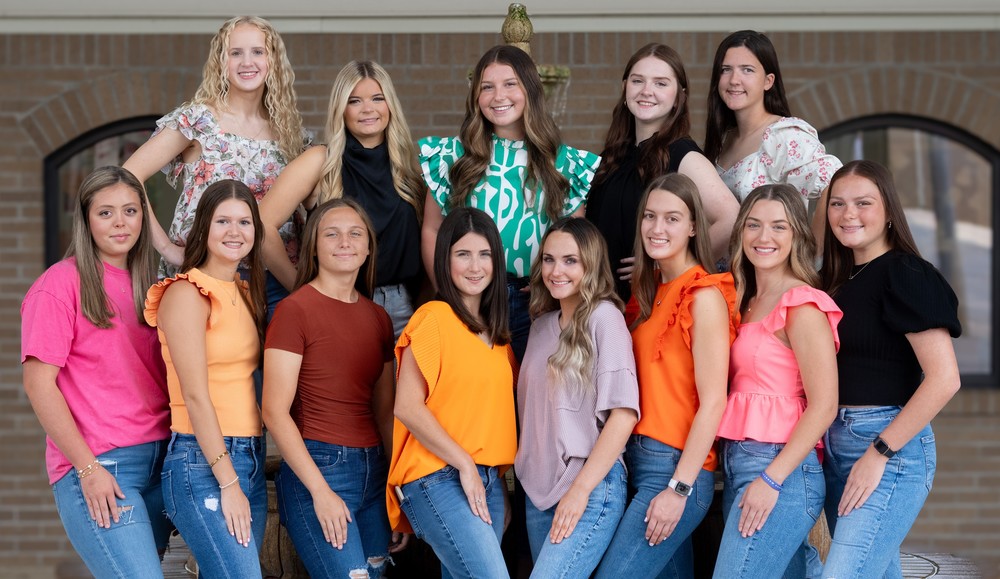 A group of women standing next to each other.