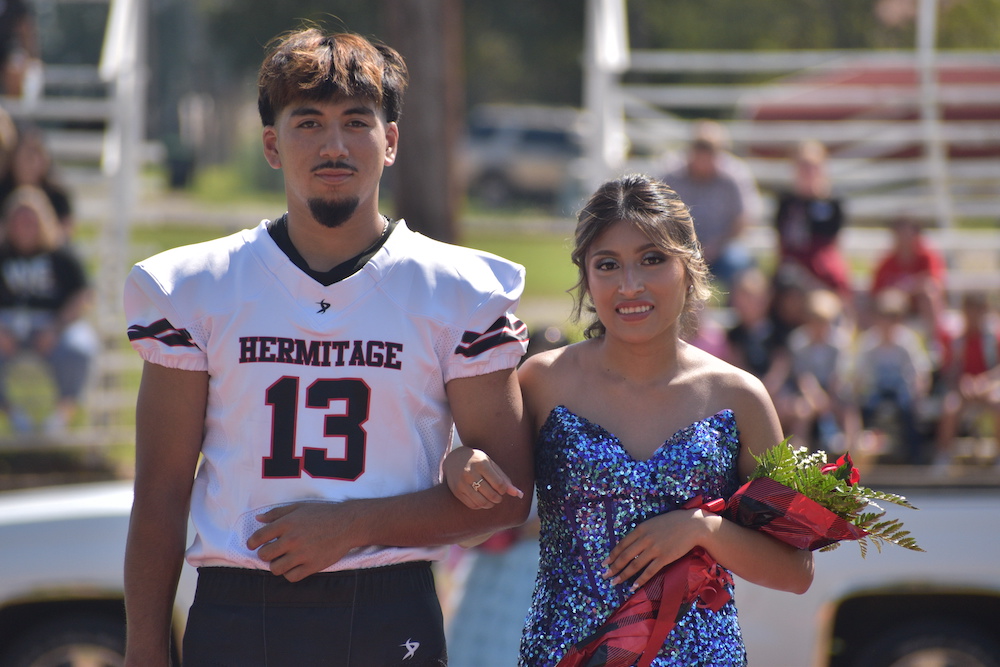 A man and woman standing next to each other.