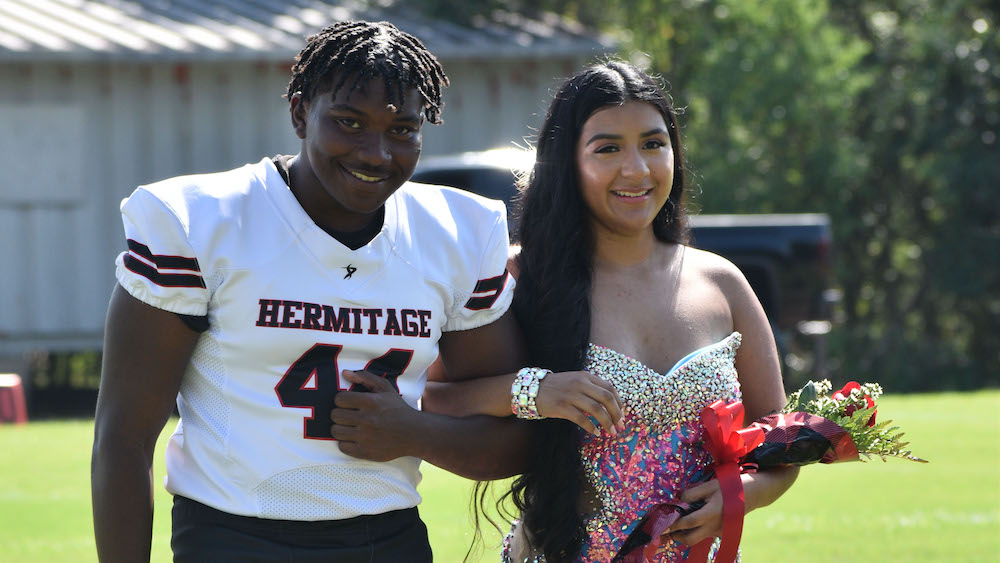 A man and woman posing for the camera.