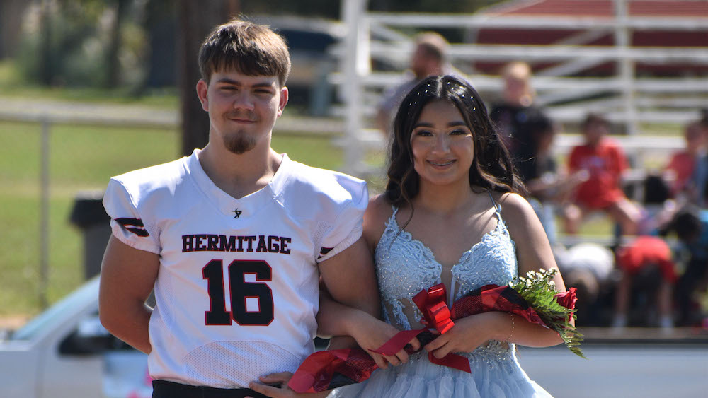 A man and woman posing for the camera.