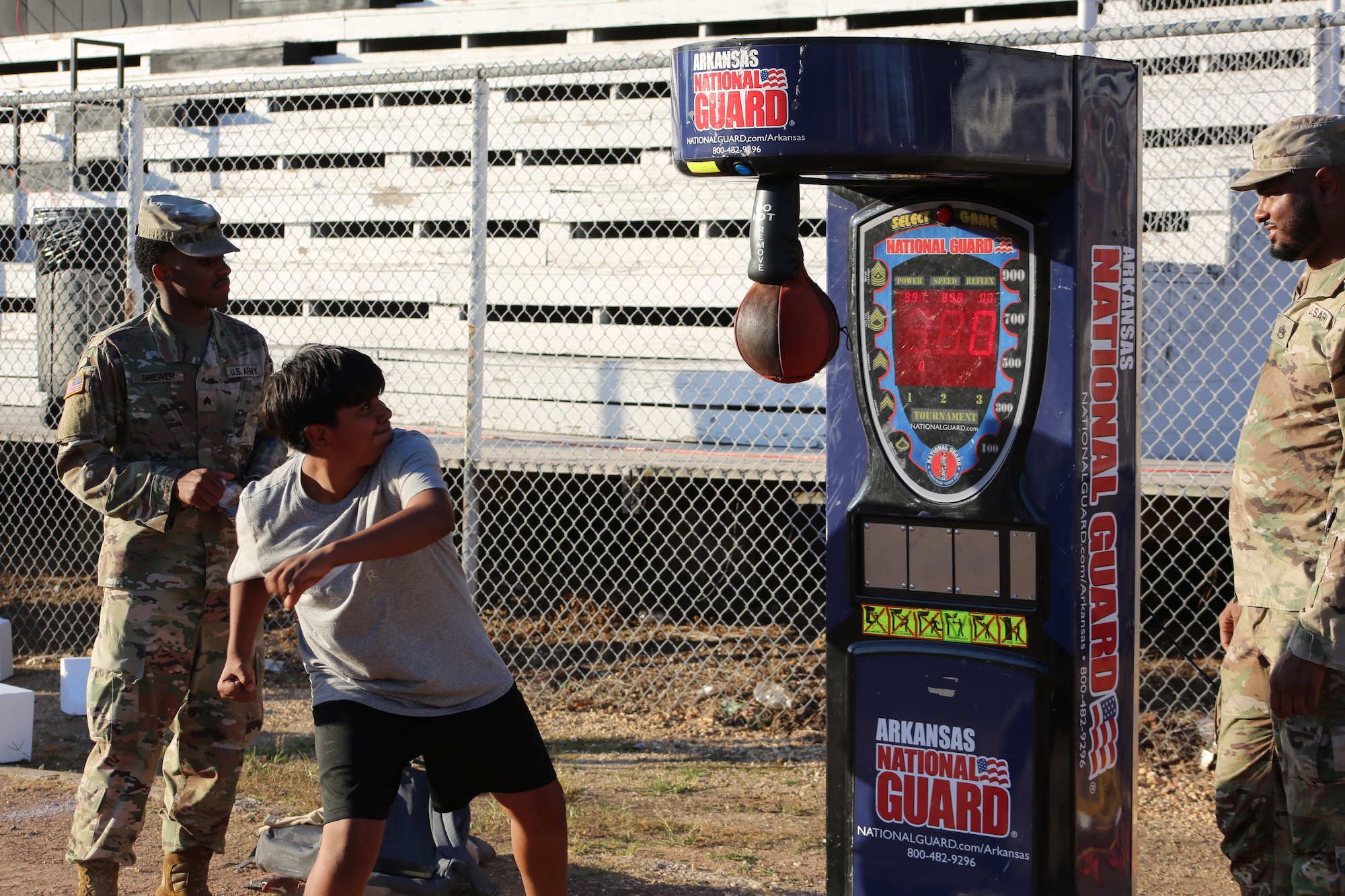 A man hitting a ball with a punching bag.