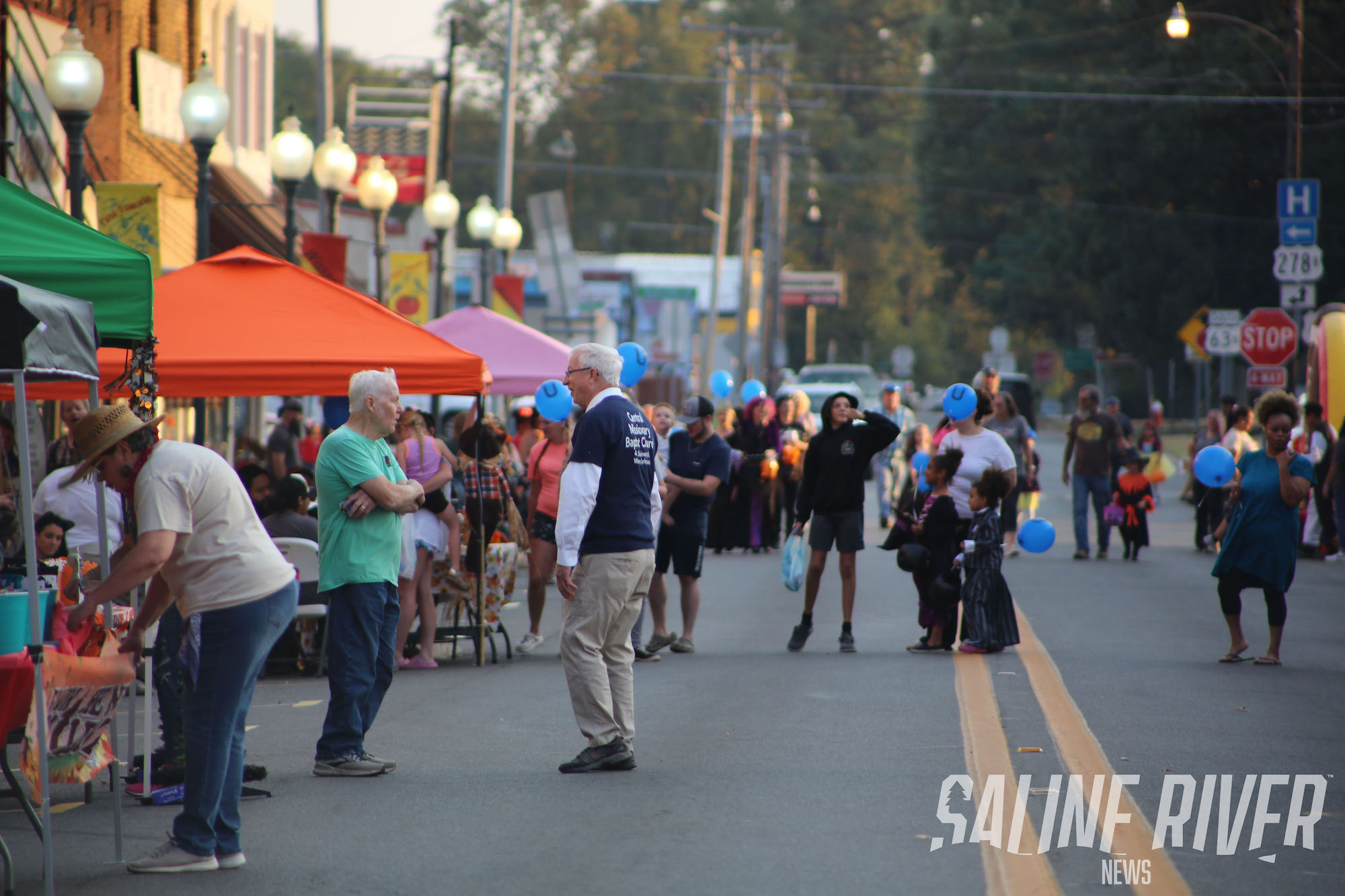 A group of people walking down the street.