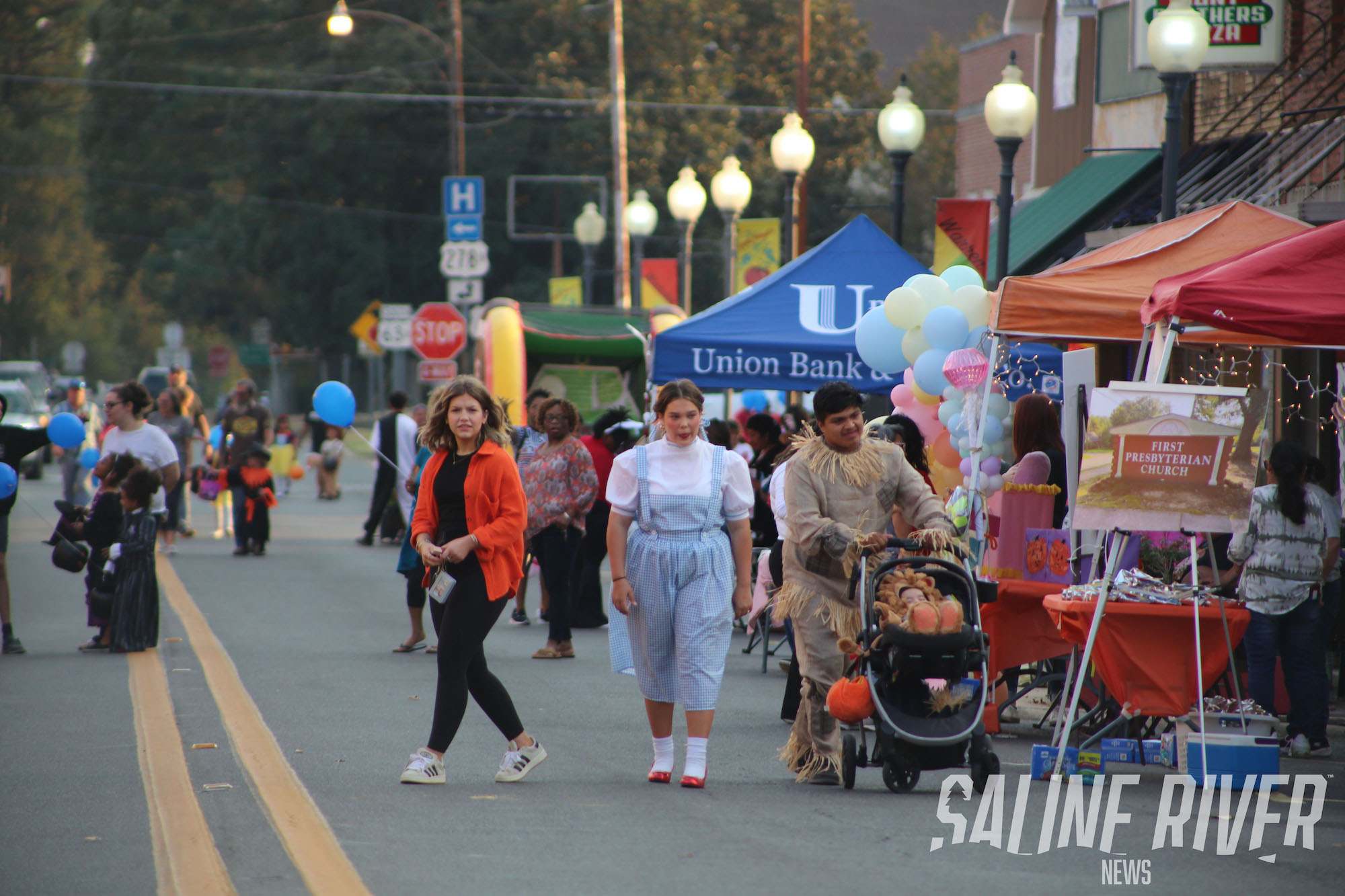 A group of people walking down the street.