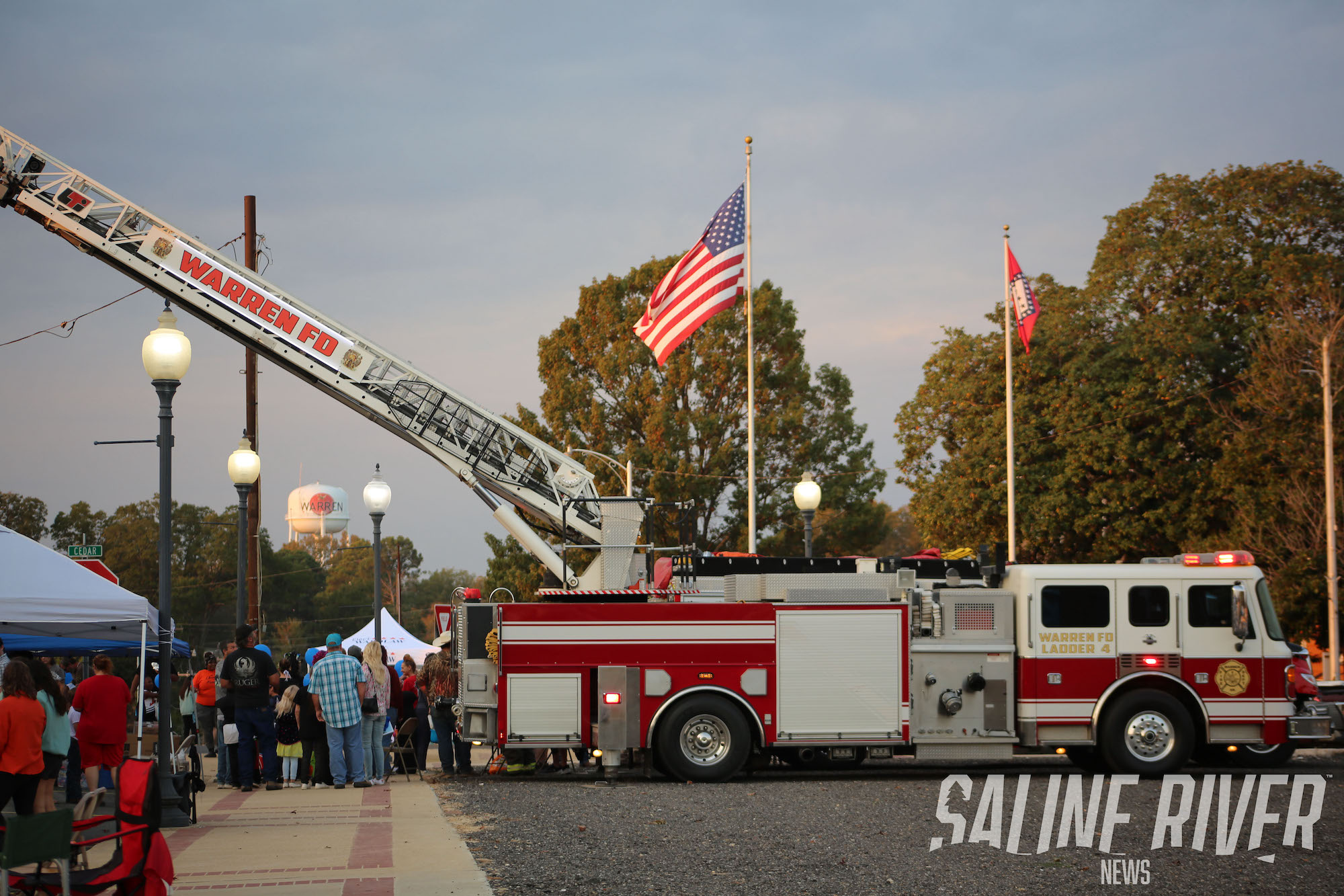 A fire truck with an american flag on it's back.