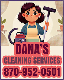 A woman holding a vacuum cleaner in her hand.