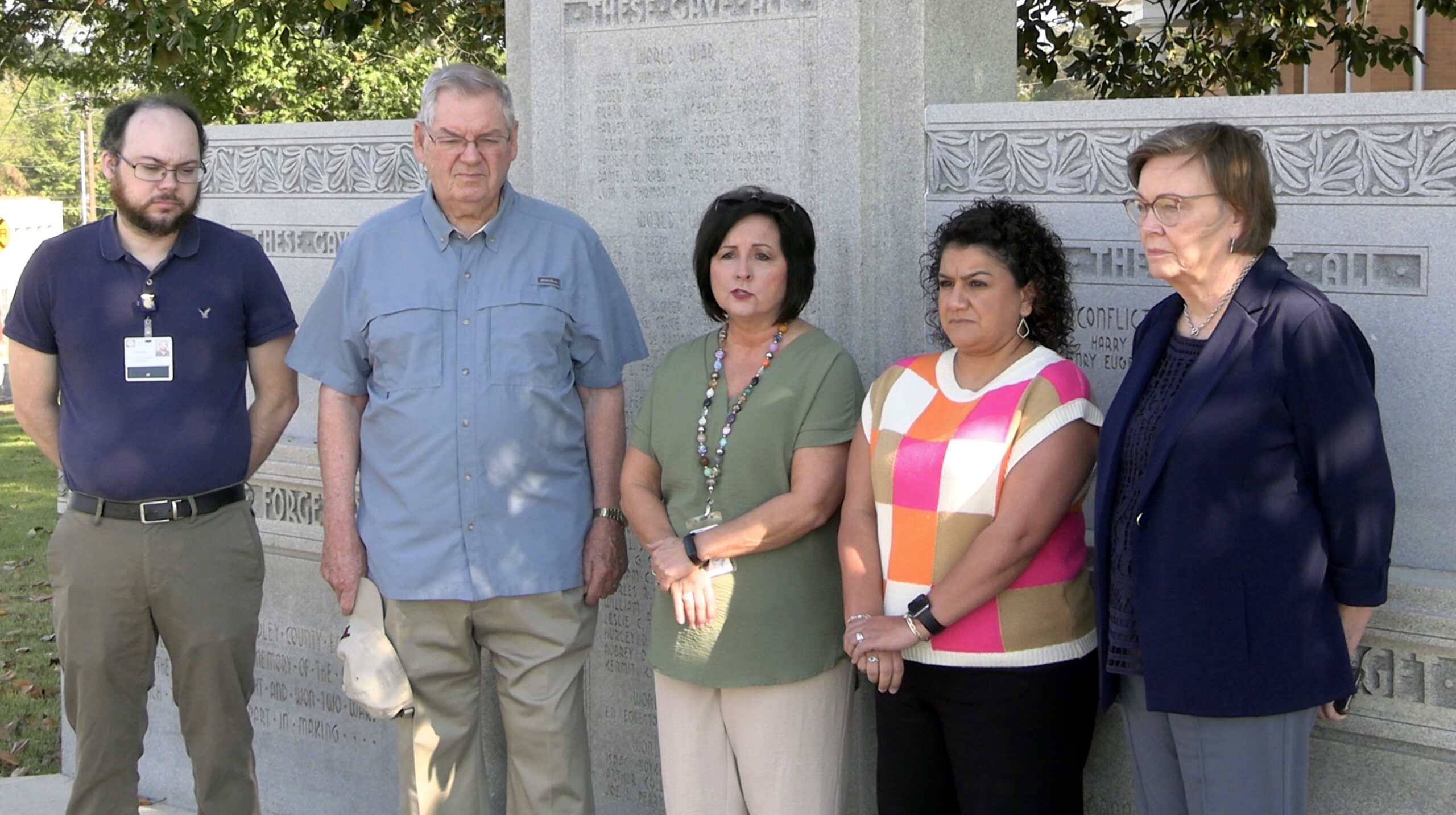 A group of people standing next to each other.