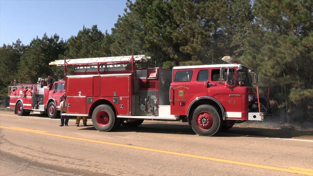 A fire truck is parked on the side of the road.