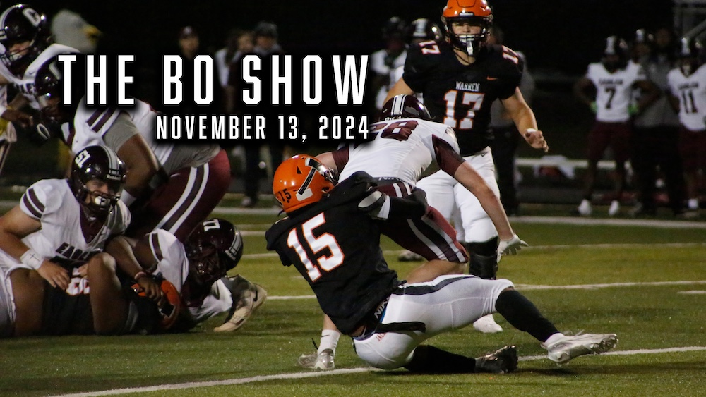 A group of football players on the field.