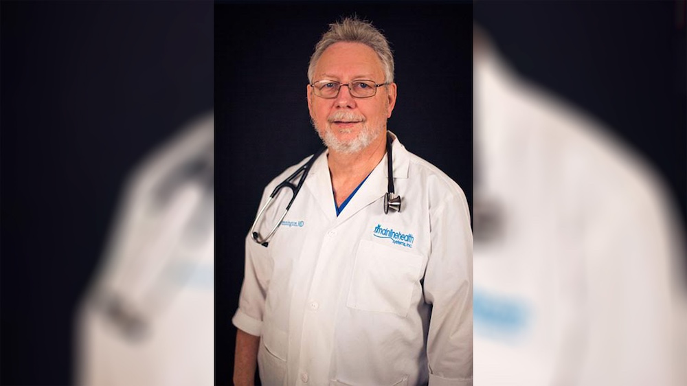 A man in white lab coat with stethoscope.