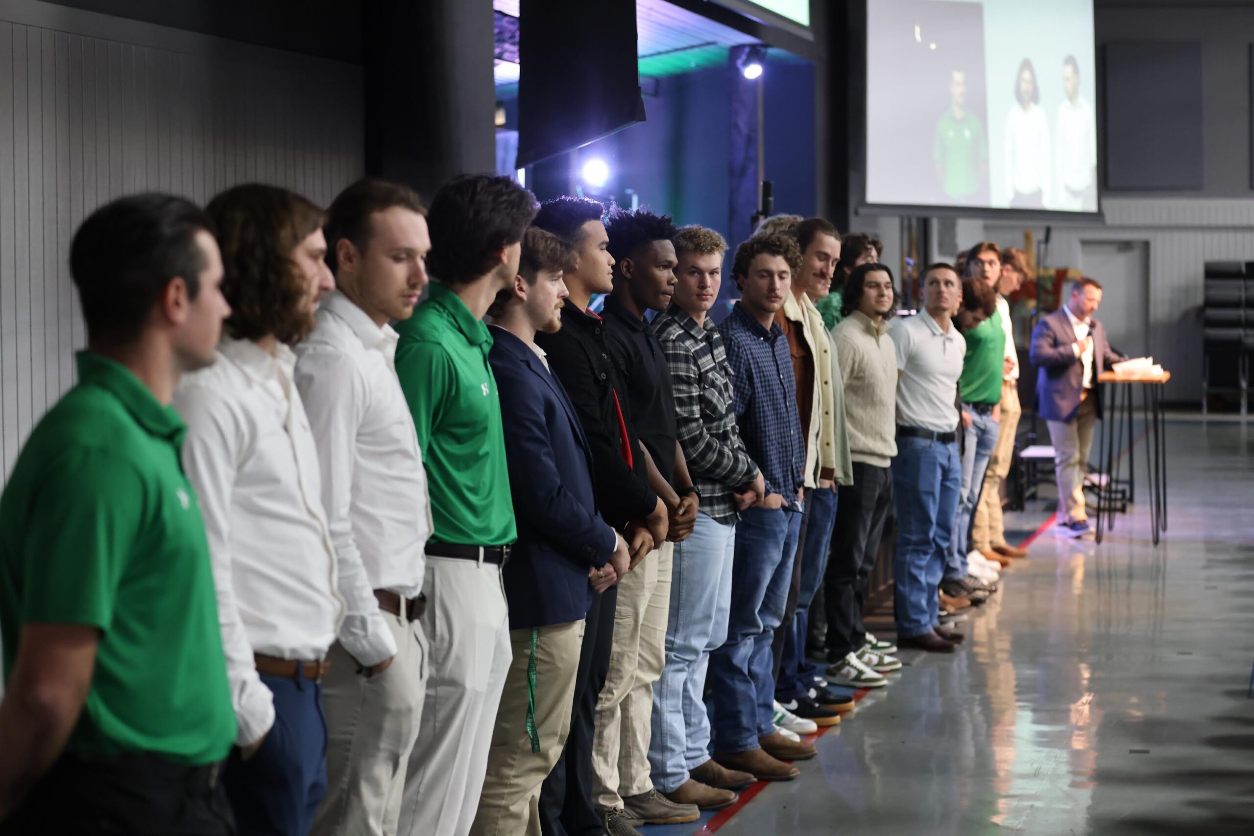 A group of people standing in line at an event.