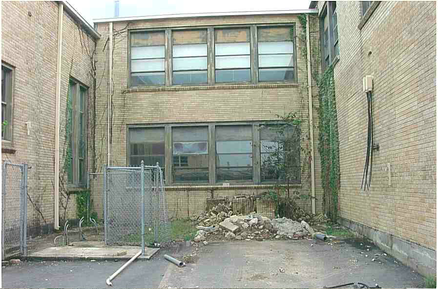 A building that has been demolished and is being torn down.