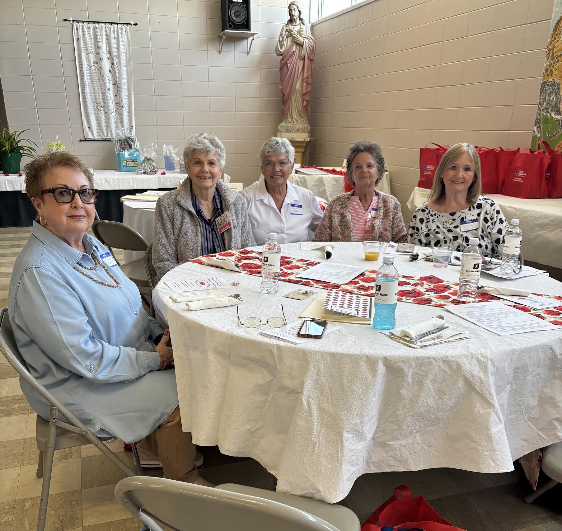 A group of people sitting around a table.