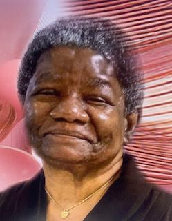 A close up of an older person with a pink background