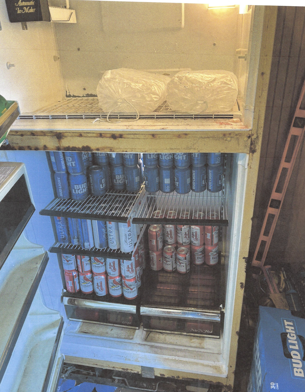 A large metal shelf with many cans of soda.