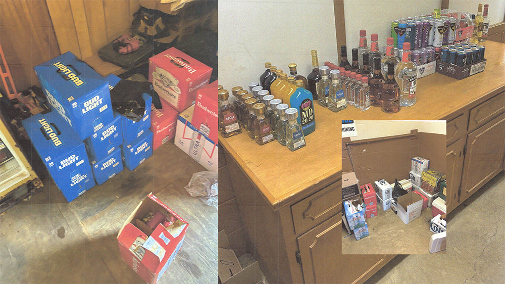A bunch of liquor bottles and boxes on the floor