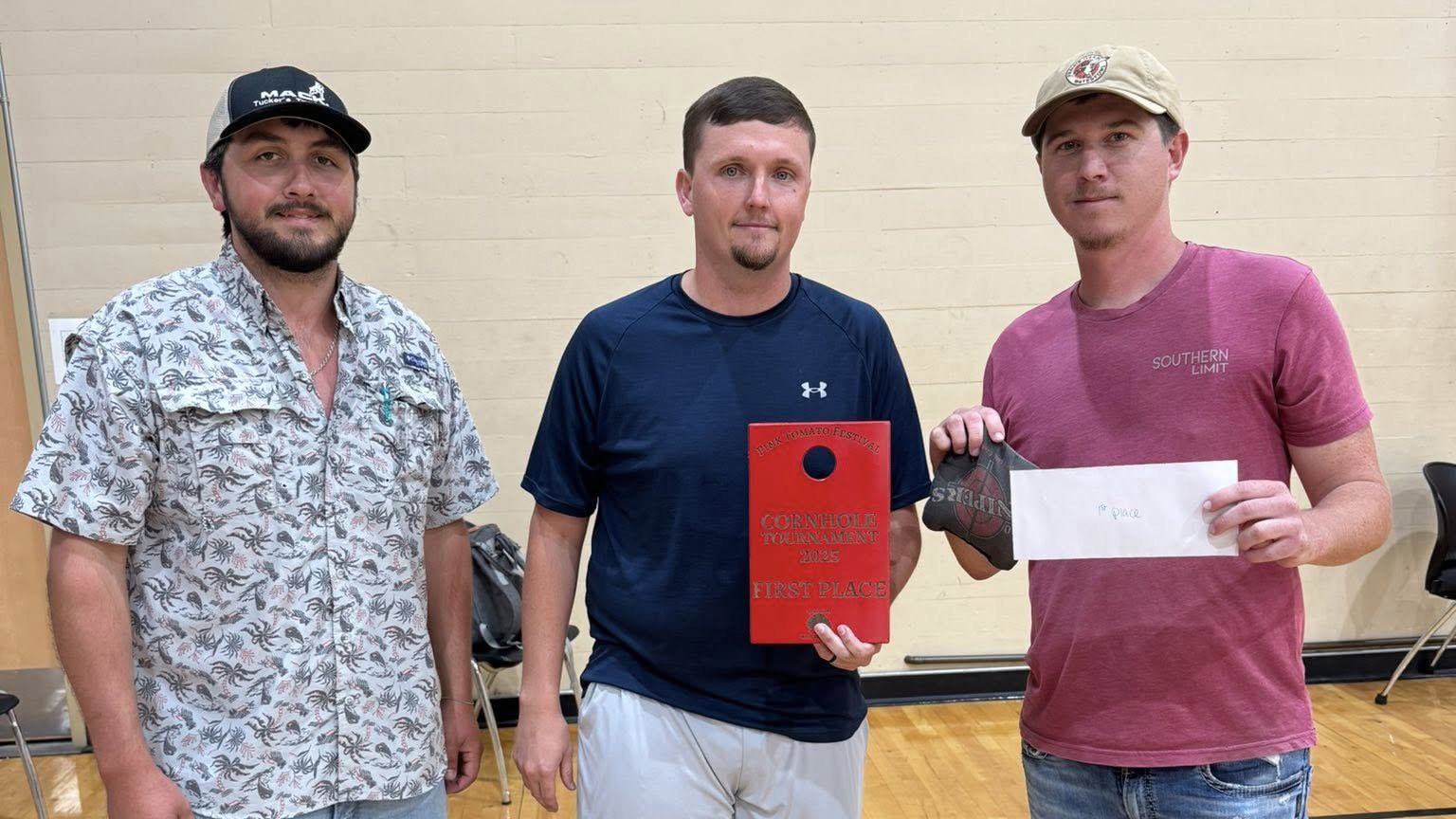 Brandon and Logan Adair Take First Place in Pink Tomato Festival Cornhole Tournament