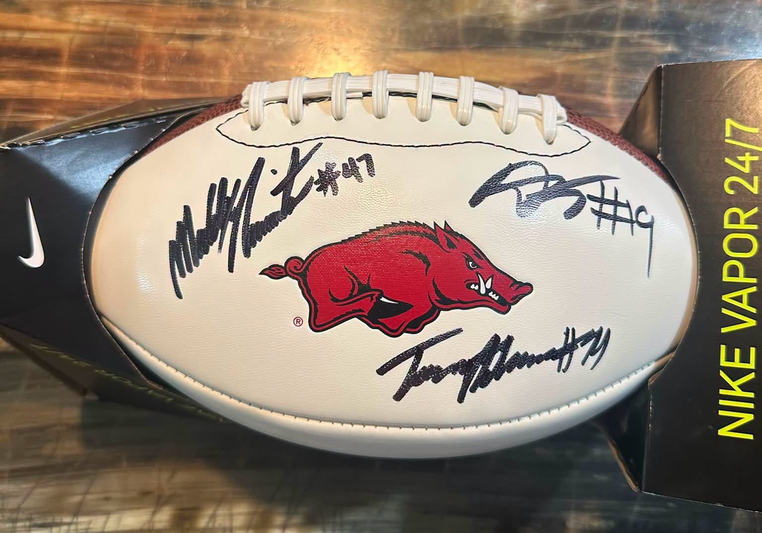 Signed Razorback football featuring three Lumberjacks to be auctioned Aug. 11